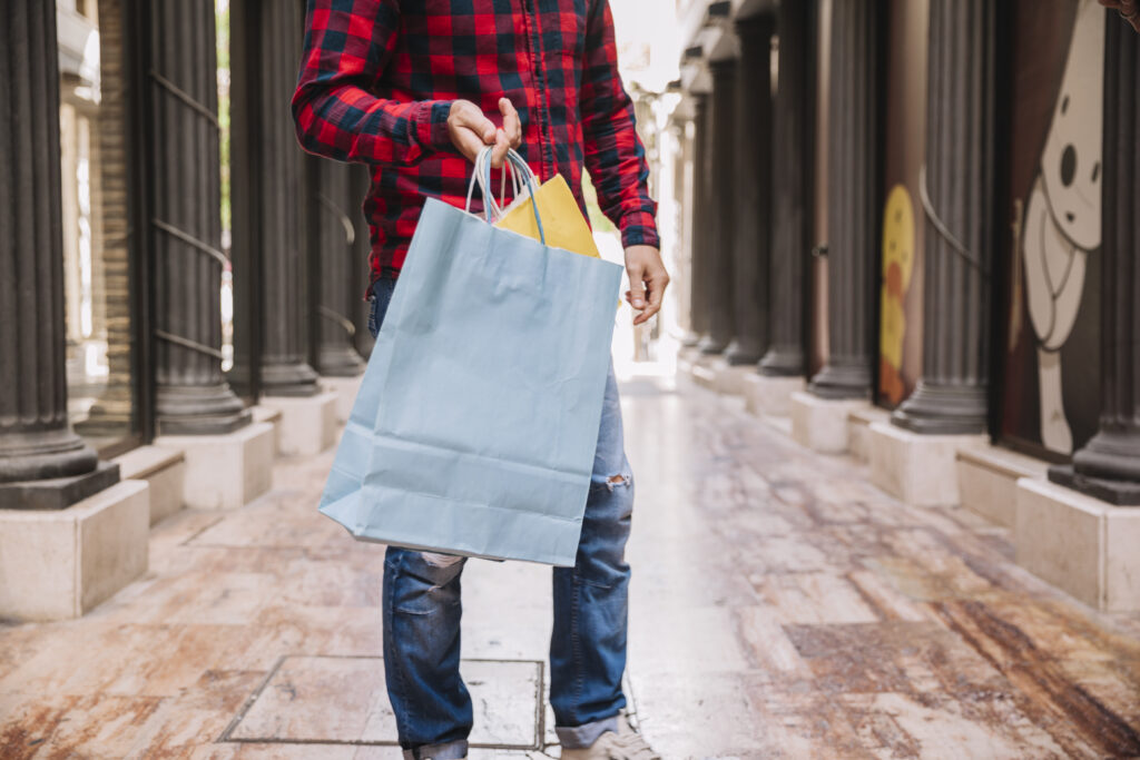 man holding shopping bag